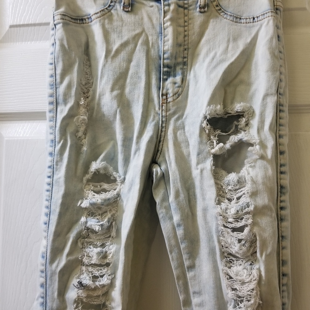 Very light blue denim distressed jeans